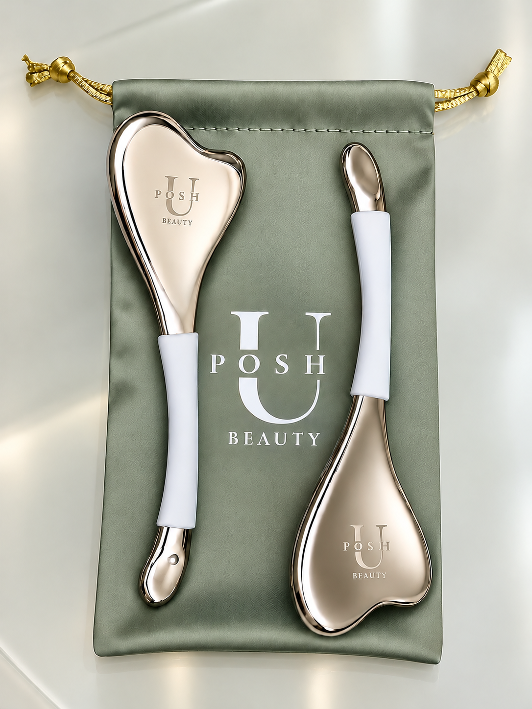 UPosh Beauty luxury cryo facial massage tools set, criyo gua sha face sculpting tool with white handles, skin lifting and contouring beauty tools in a sage green travel pouch.